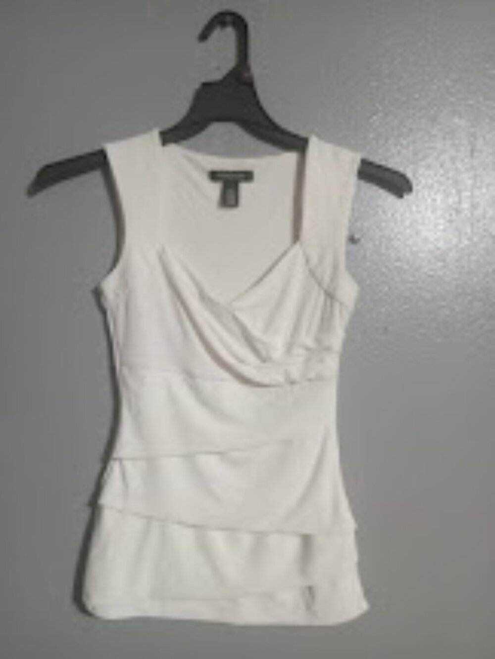 White sleeveless blouse draped tiered sleeveless